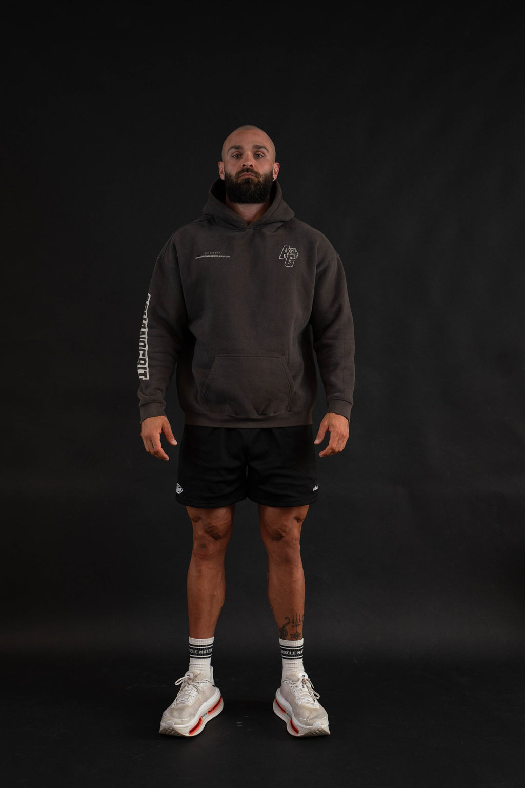 Championship Hoodie front view on a male model
