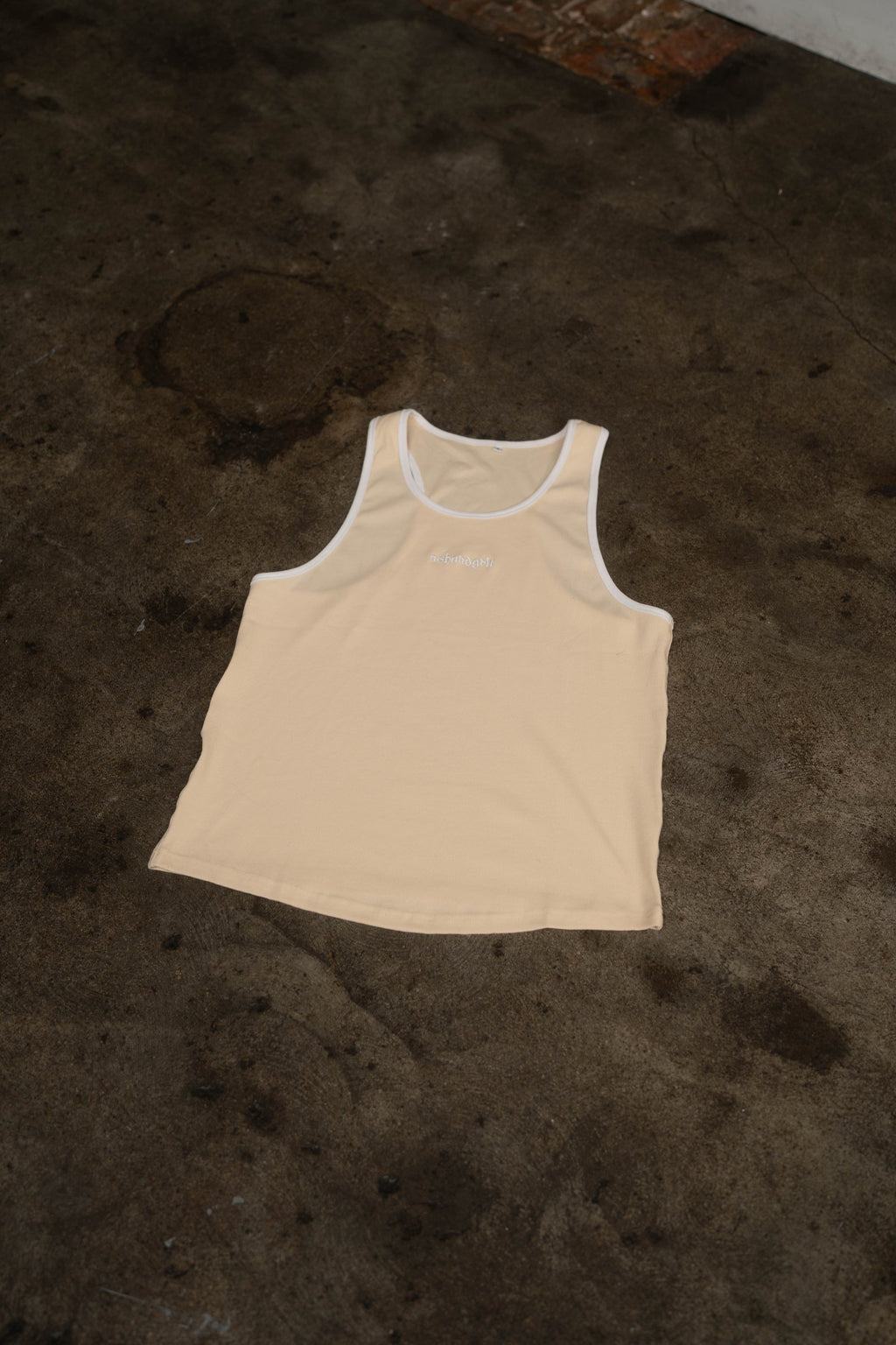 Essential Piped Stringer in Sandstone Tan, flat lay