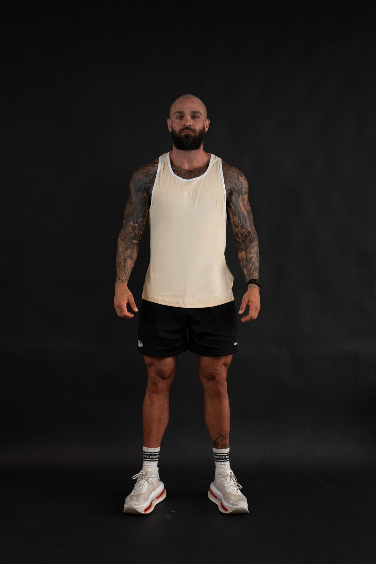 Essential Piped Stringer in Sandstone Tan, front view on a male model