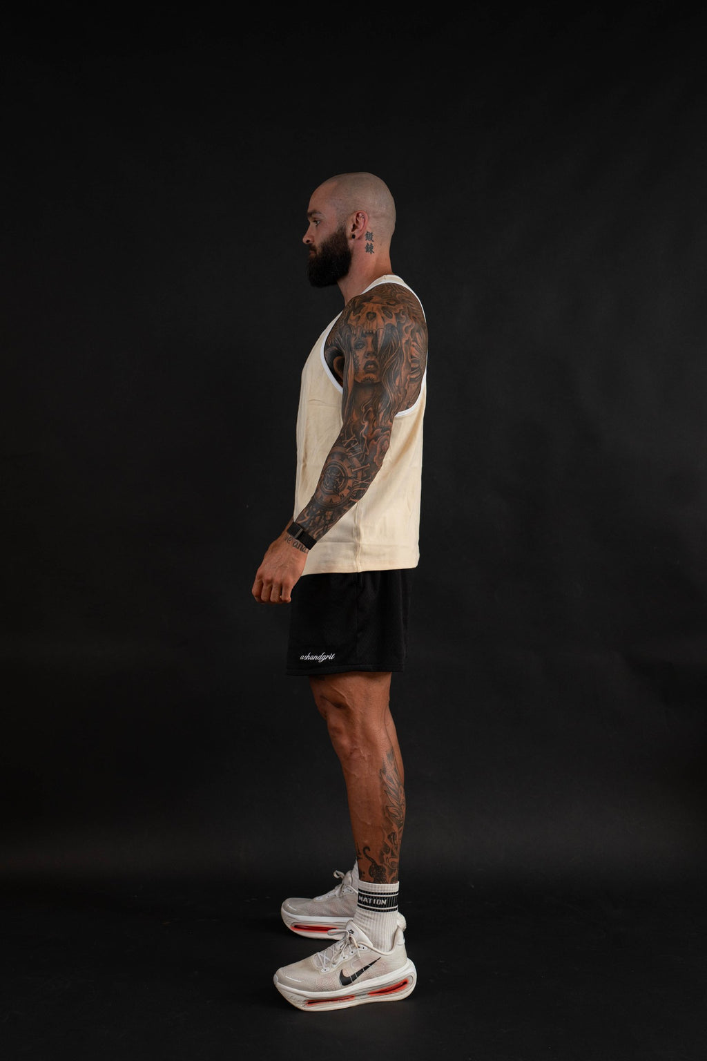 Essential Piped Stringer in Sandstone Tan, side view on a male model