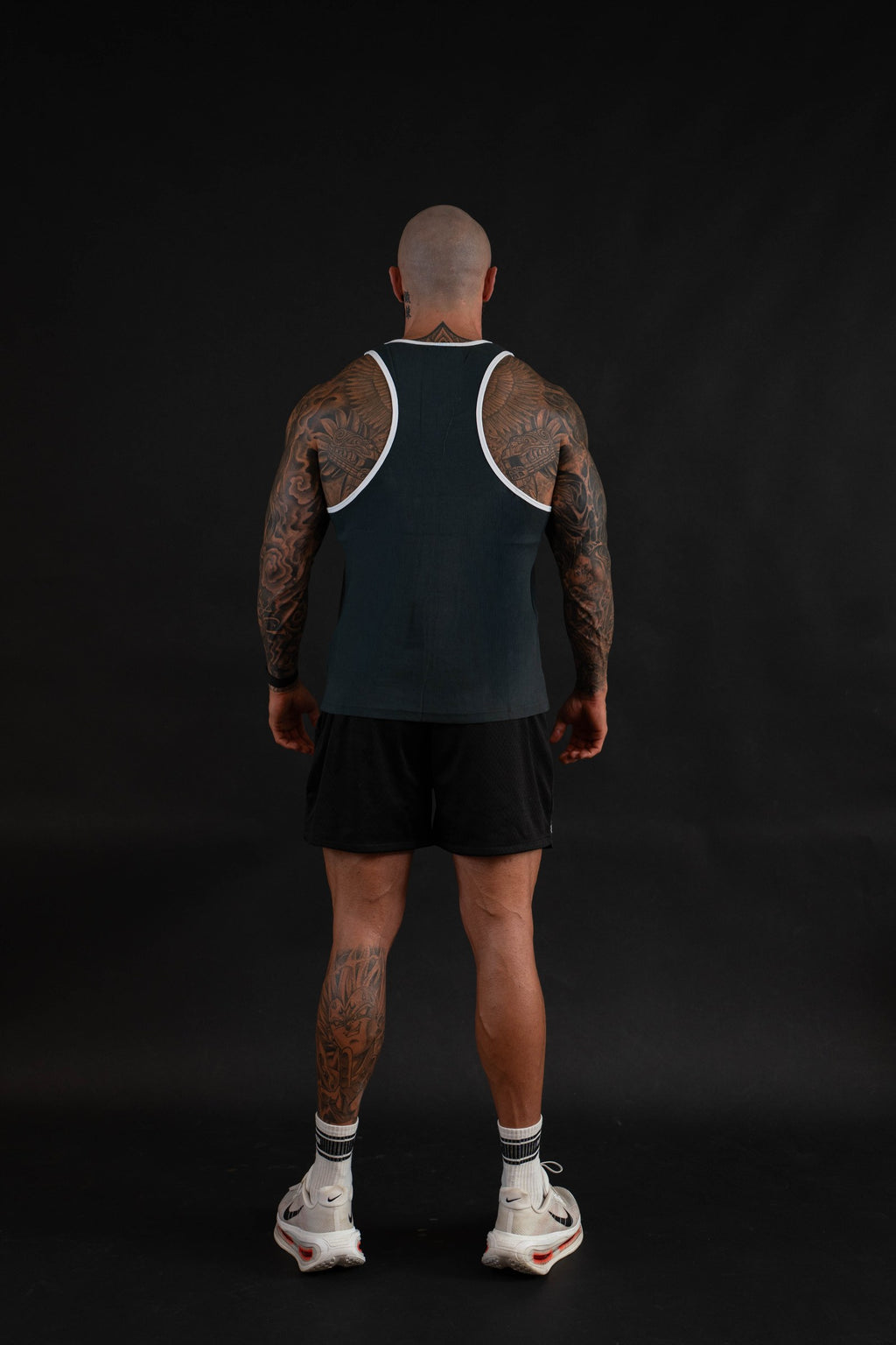 Essential Piped Stringer in Slate Green, racerback view on a male model