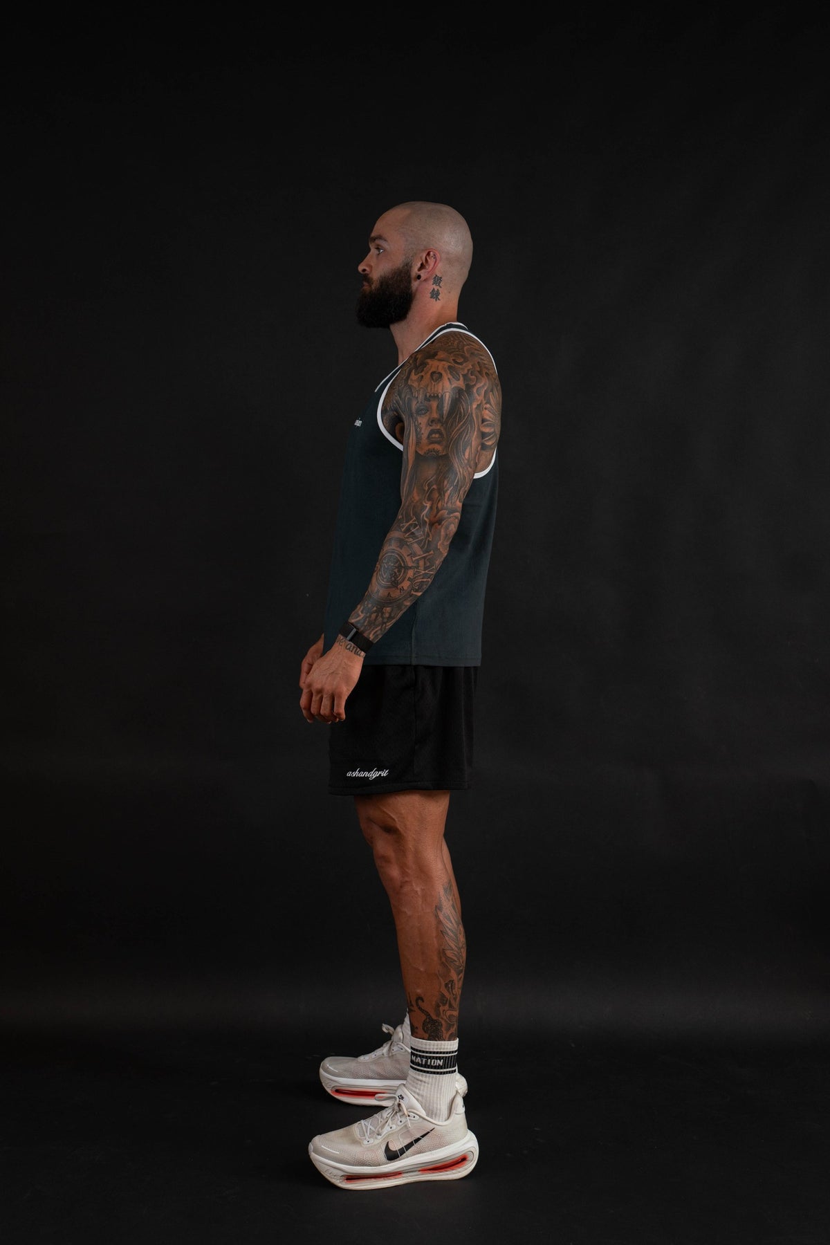 Essential Piped Stringer in Slate Green, side view on a male model