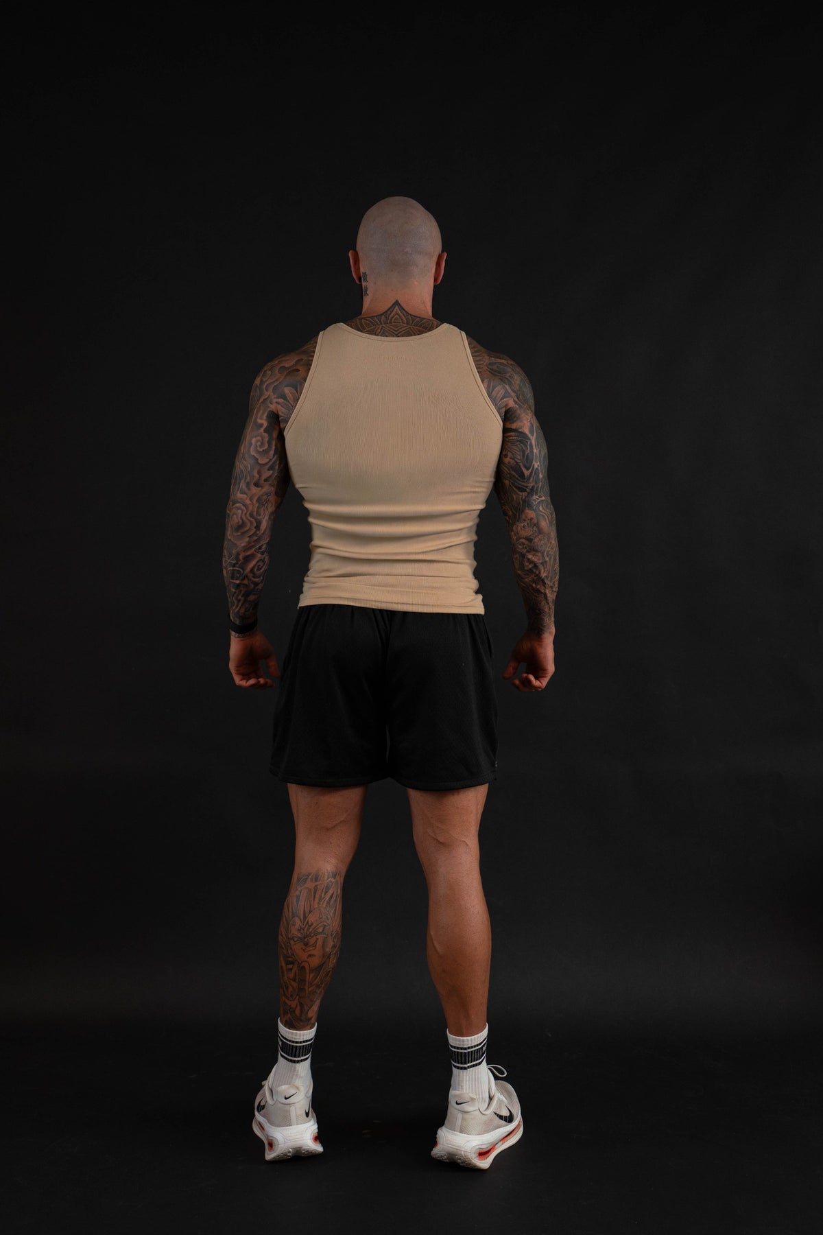 Grit Beater in Sand, back view on a male model