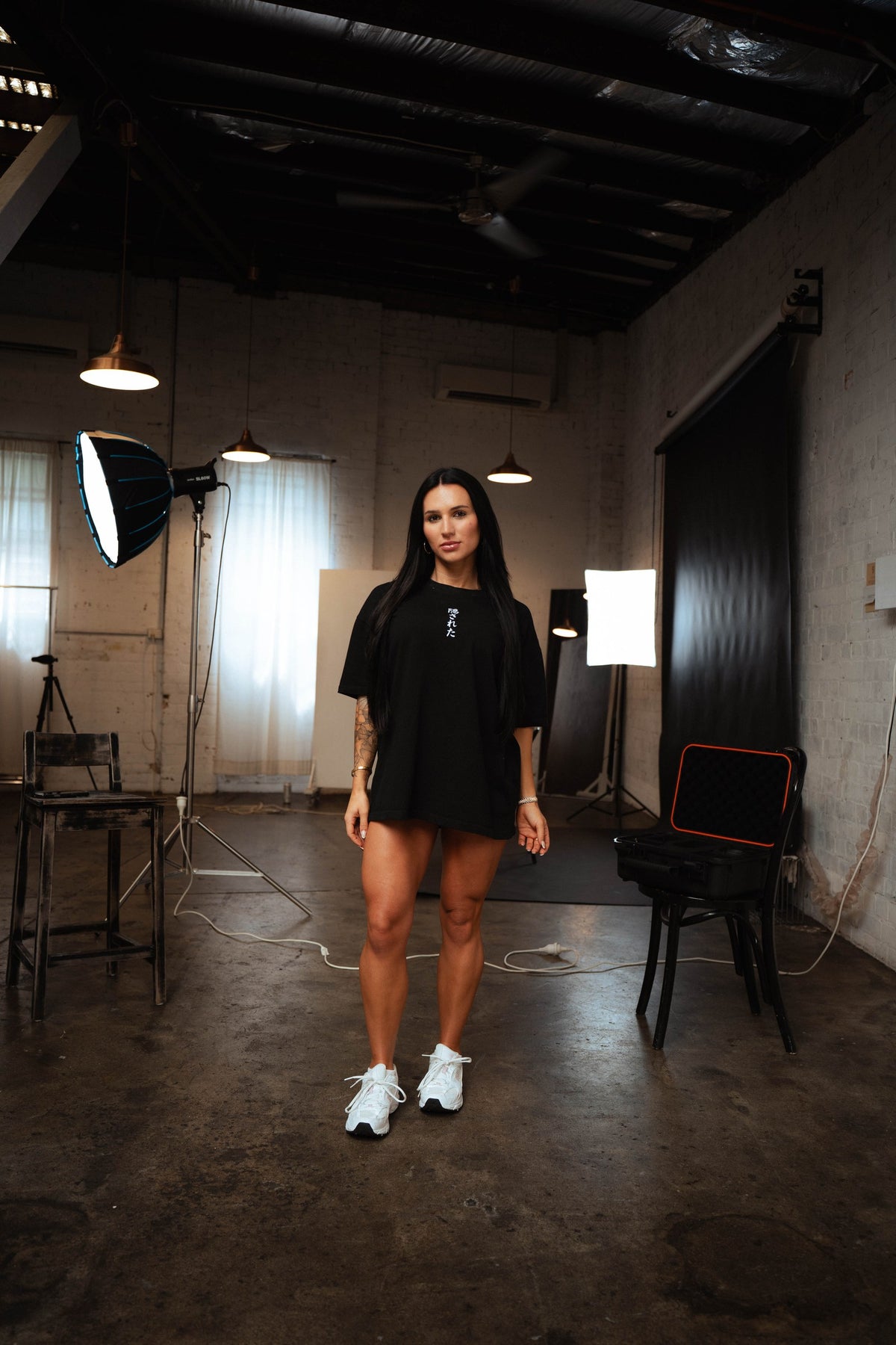 Hidden T-Shirt worn oversized by a female model in the studio