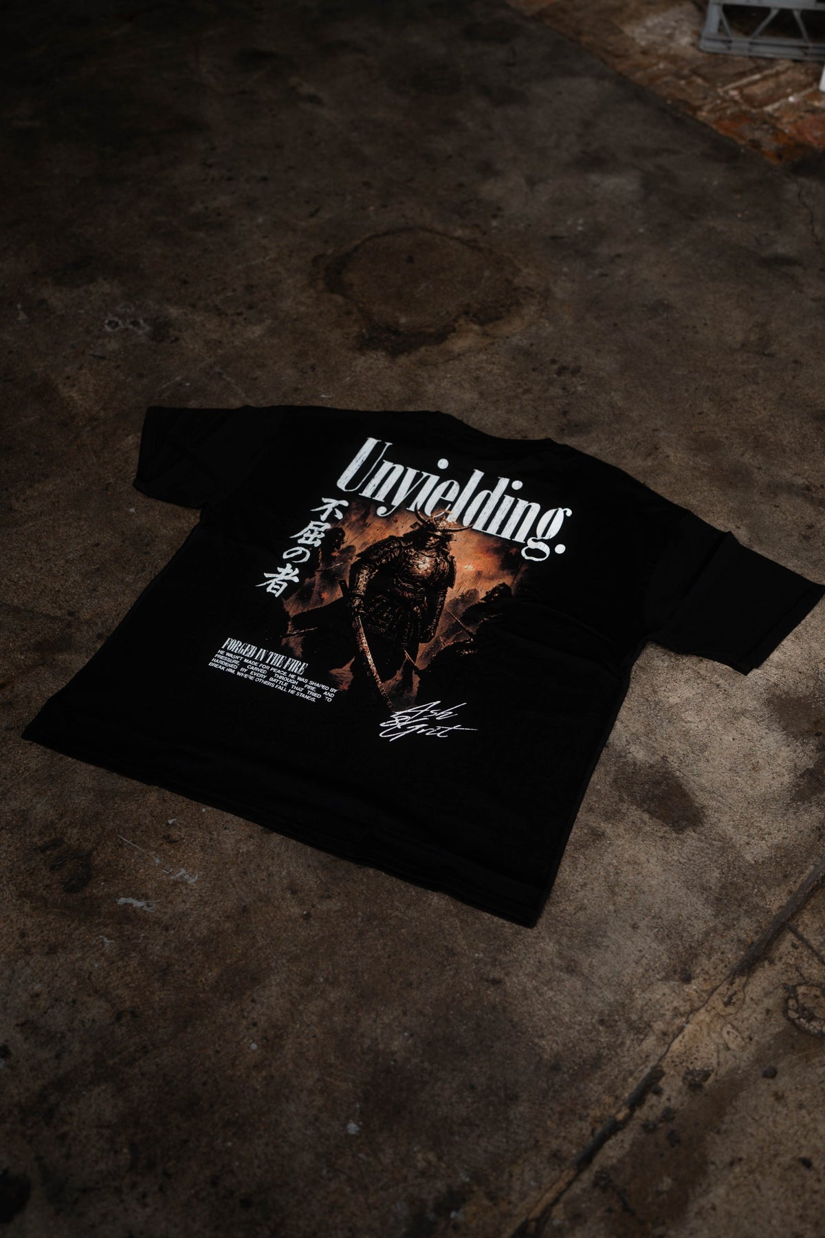 Unyielding T-Shirt back graphic, flat lay
