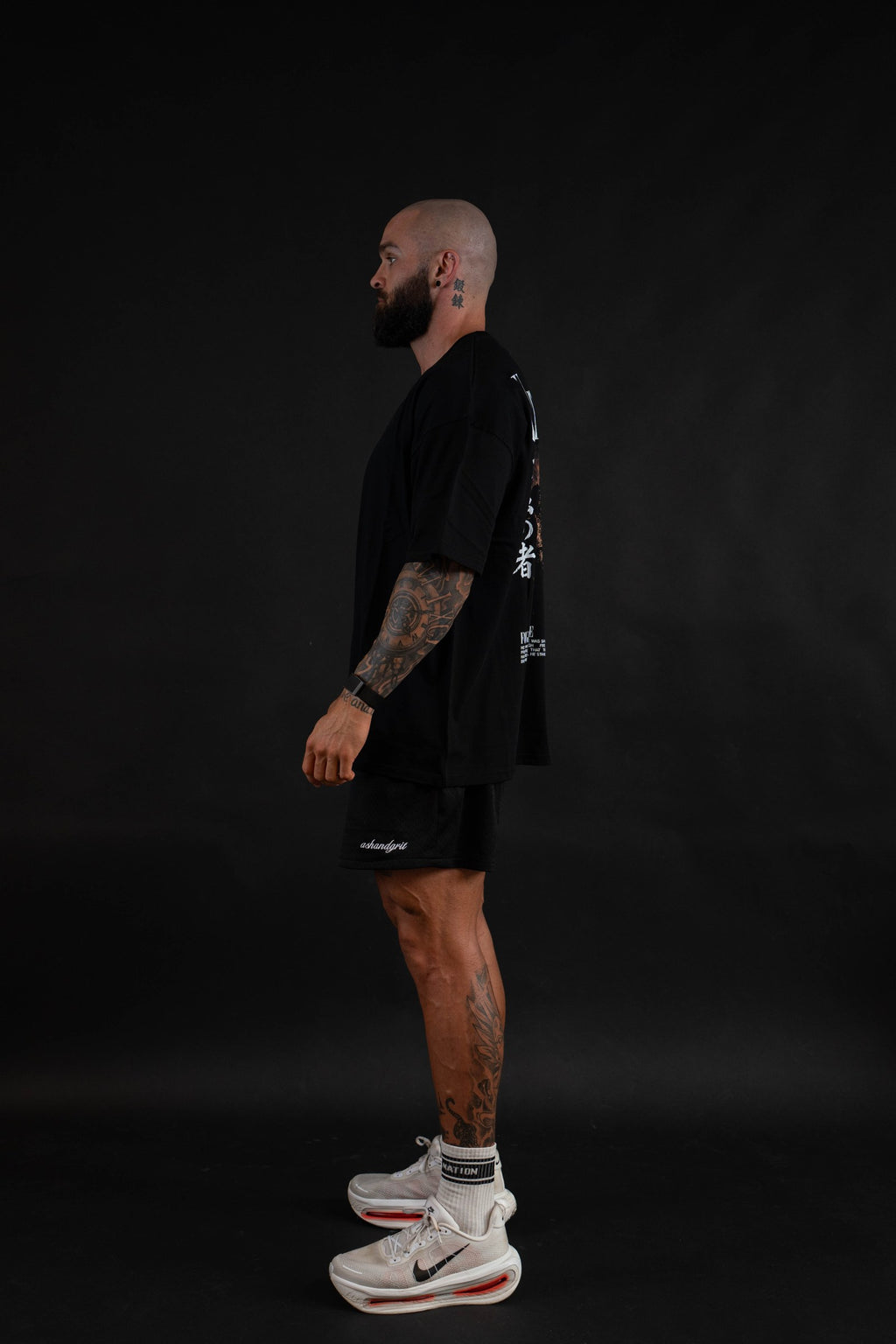 Unyielding T-Shirt side view on a male model