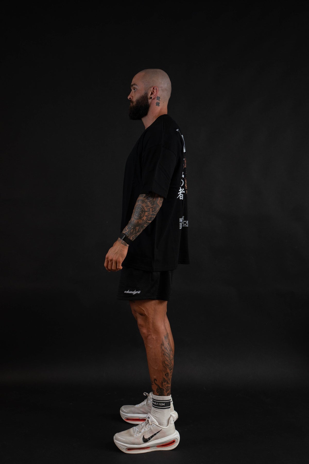Unyielding T-Shirt side view on a male model