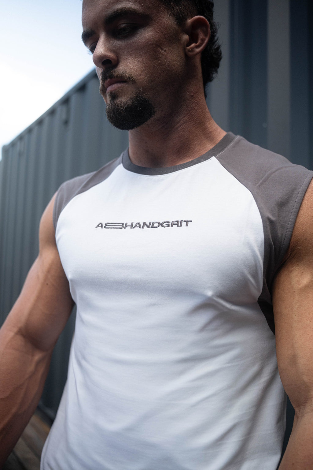 Close-up of the Pursuit Tank raglan sleeves and embroidered logo