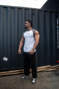 Pursuit Tank in white and charcoal, worn by a model, front view